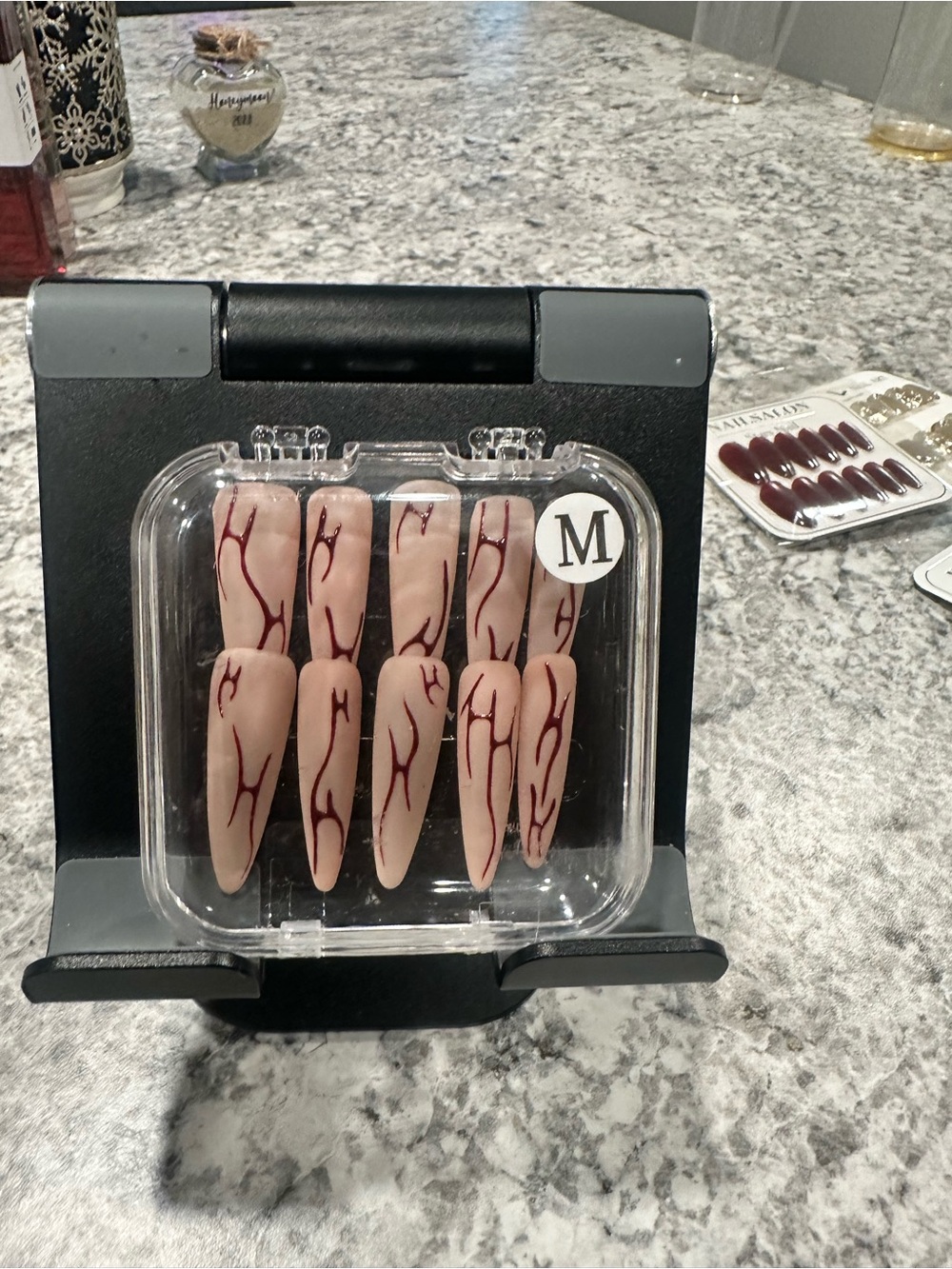 Nude Stiletto Press-On Nails with Red Vein Design